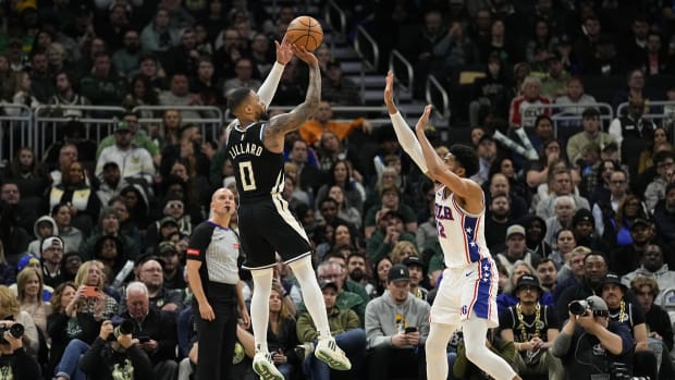  Milwaukee Bucks guard Damian Lillard (0) shoots over Philadelphia 76ers forward Tobias Harris (12) 
